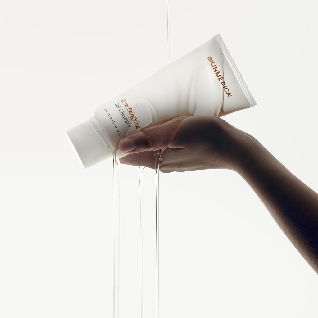SkinMedica Pore Purifying Gel Cleanser lifestyle shot showing the cleanser bottle in a styled setting
