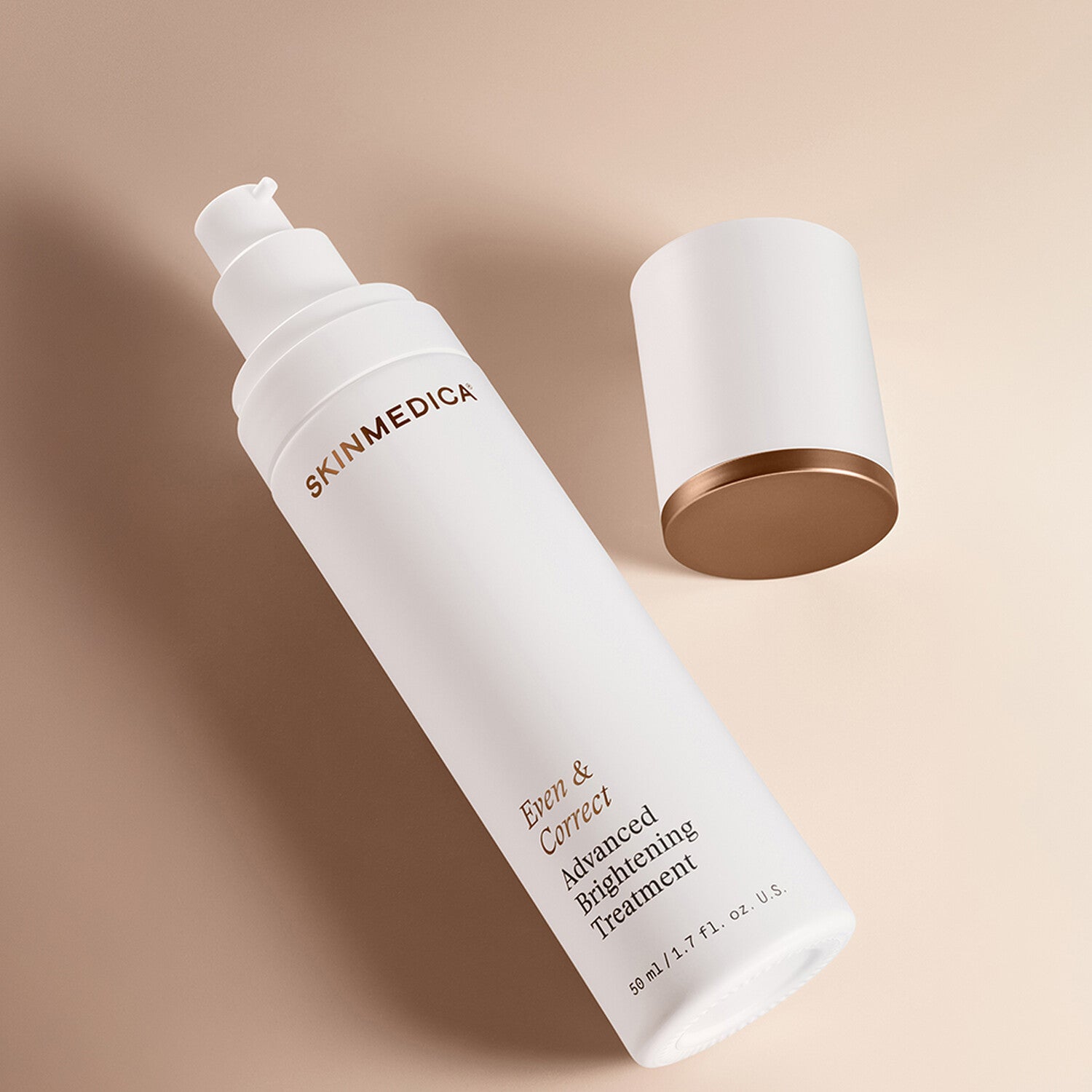 SkinMedica Even and Correct Advanced Brightening Treatment lifestyle shot showing the serum bottle in a styled setting