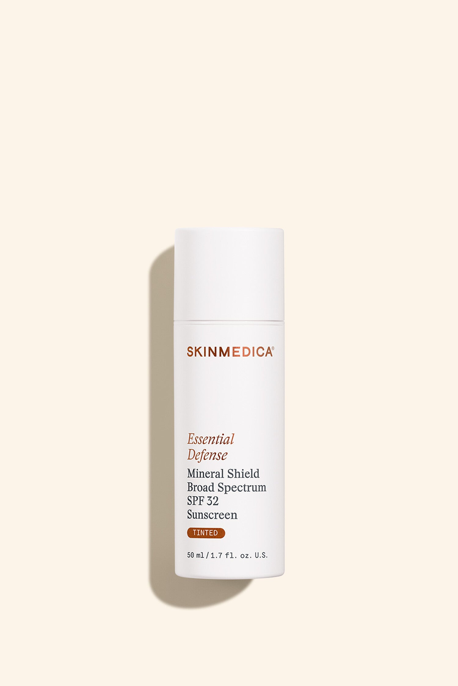 SkinMedica Essential Defense Mineral Shield Broad Spectrum SPF 32 Sunscreen Tinted 1.7 fl oz, official product photo on white background